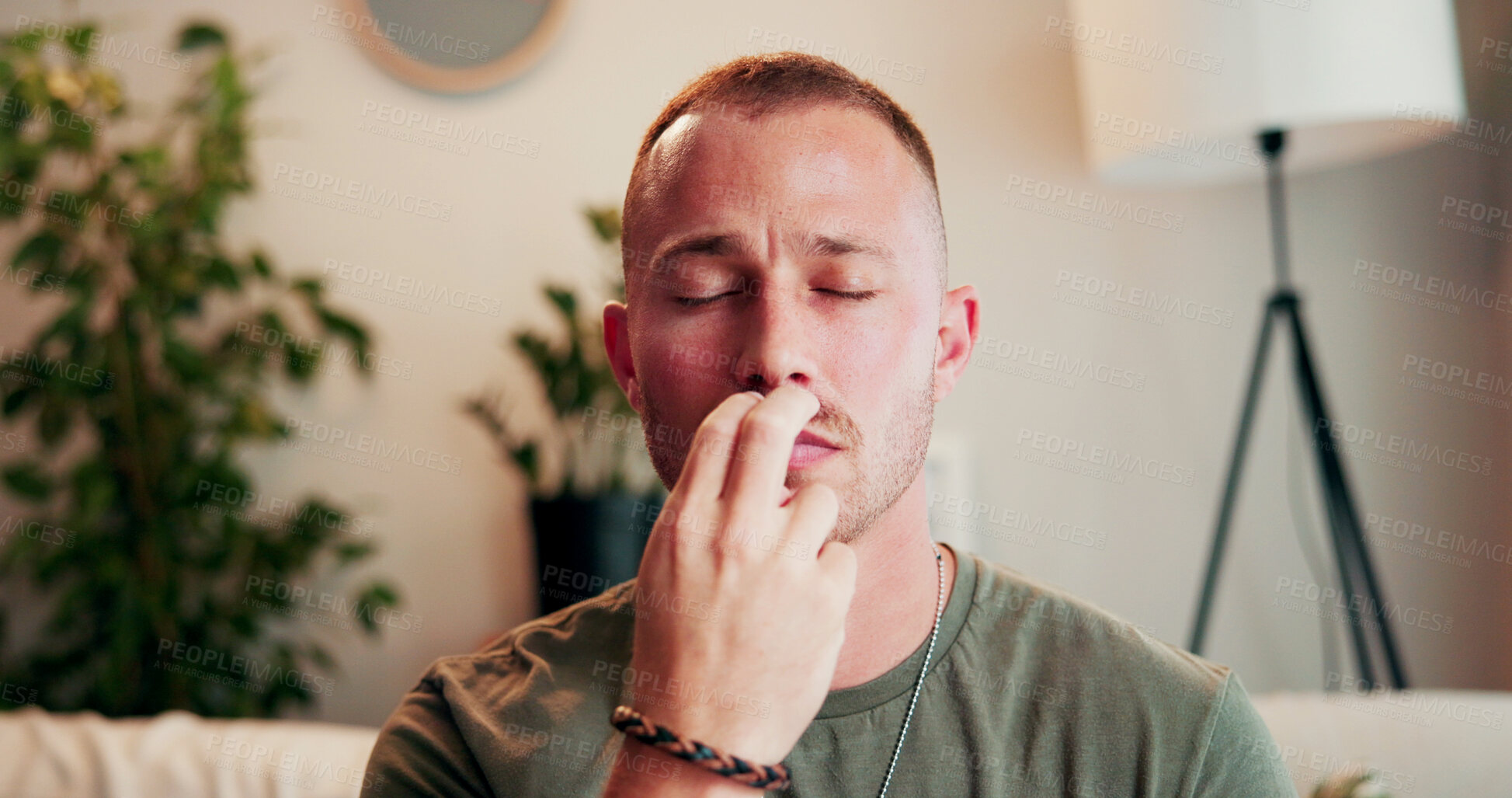 Buy stock photo Breathe, therapy and man on sofa for holistic healing, mindfulness or calm for counseling. Psychology, somatic therapist and person with pressure point for awareness, regulate emotions or eft tapping