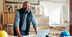 Black man, carpenter and portrait with laptop at factory, notes or manufacturing at industrial plant. Mature person, technician and smile with for review, material or production at warehouse in Kenya