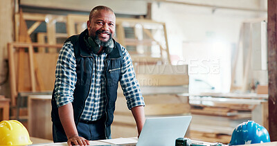 Buy stock photo Black man, carpenter and portrait with laptop at factory, notes or manufacturing at industrial plant. Mature person, technician and smile with for review, material or production at warehouse in Kenya
