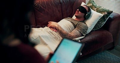 Buy stock photo Therapist, man or headphones with mask in counseling for PTSD healing, bilateral stimulation or help. Audio, patient and blindfold in psychotherapy for trauma evaluation, tablet notes or EMDR on sofa