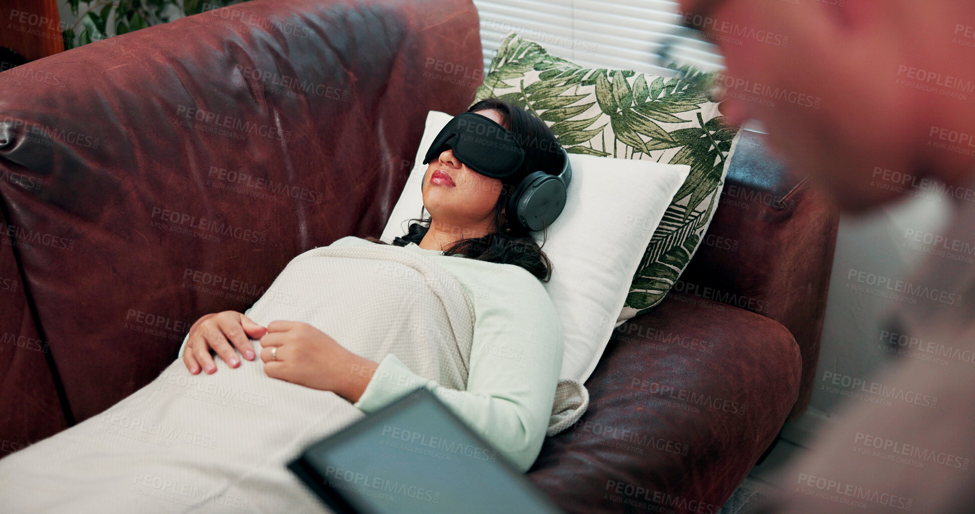Buy stock photo Psychology, treatment and woman on couch with headphones, relax or psychedelic counseling. Mental health, psilocybin therapy and person with sleep mask for anxiety, trauma or alternative medicine