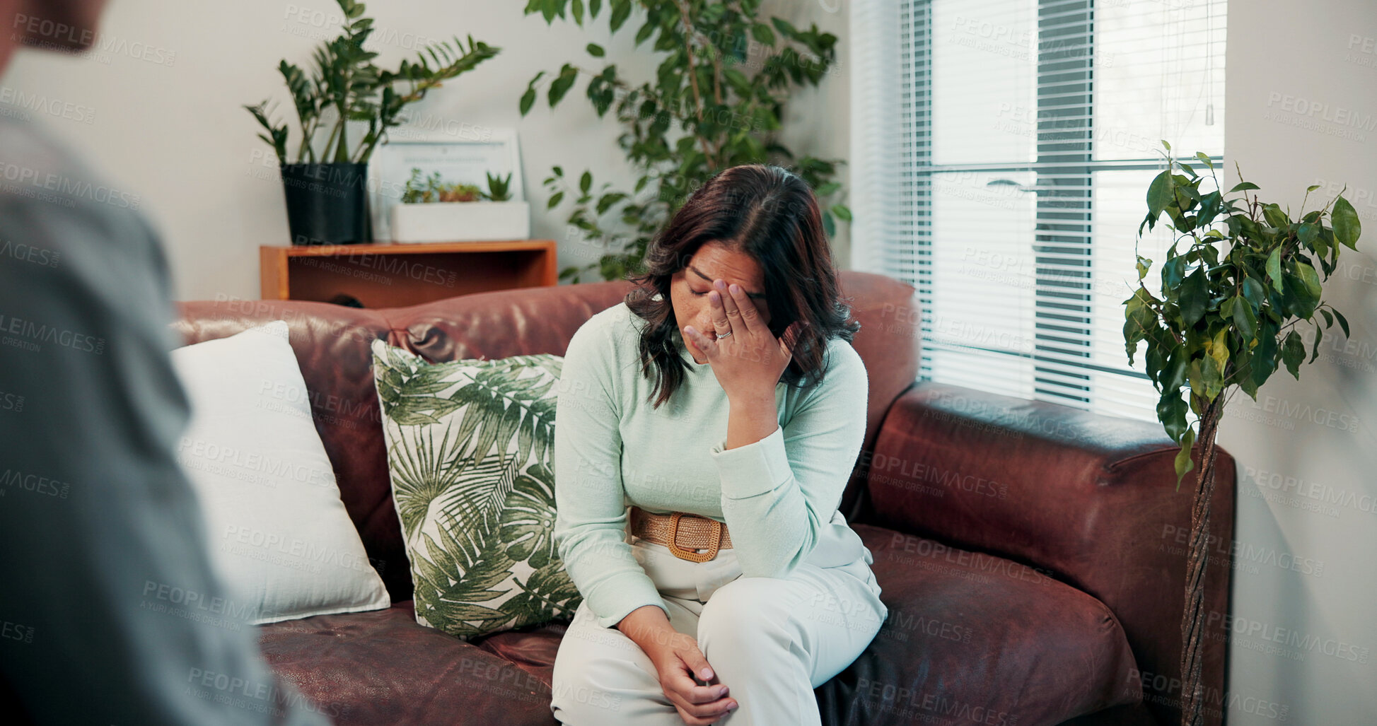 Buy stock photo Therapy, woman and conversation with anxiety, stress and sharing for counselling and mental health. Psychology, patient and nervous for evaluation in clinic with consultation, grief or trauma support
