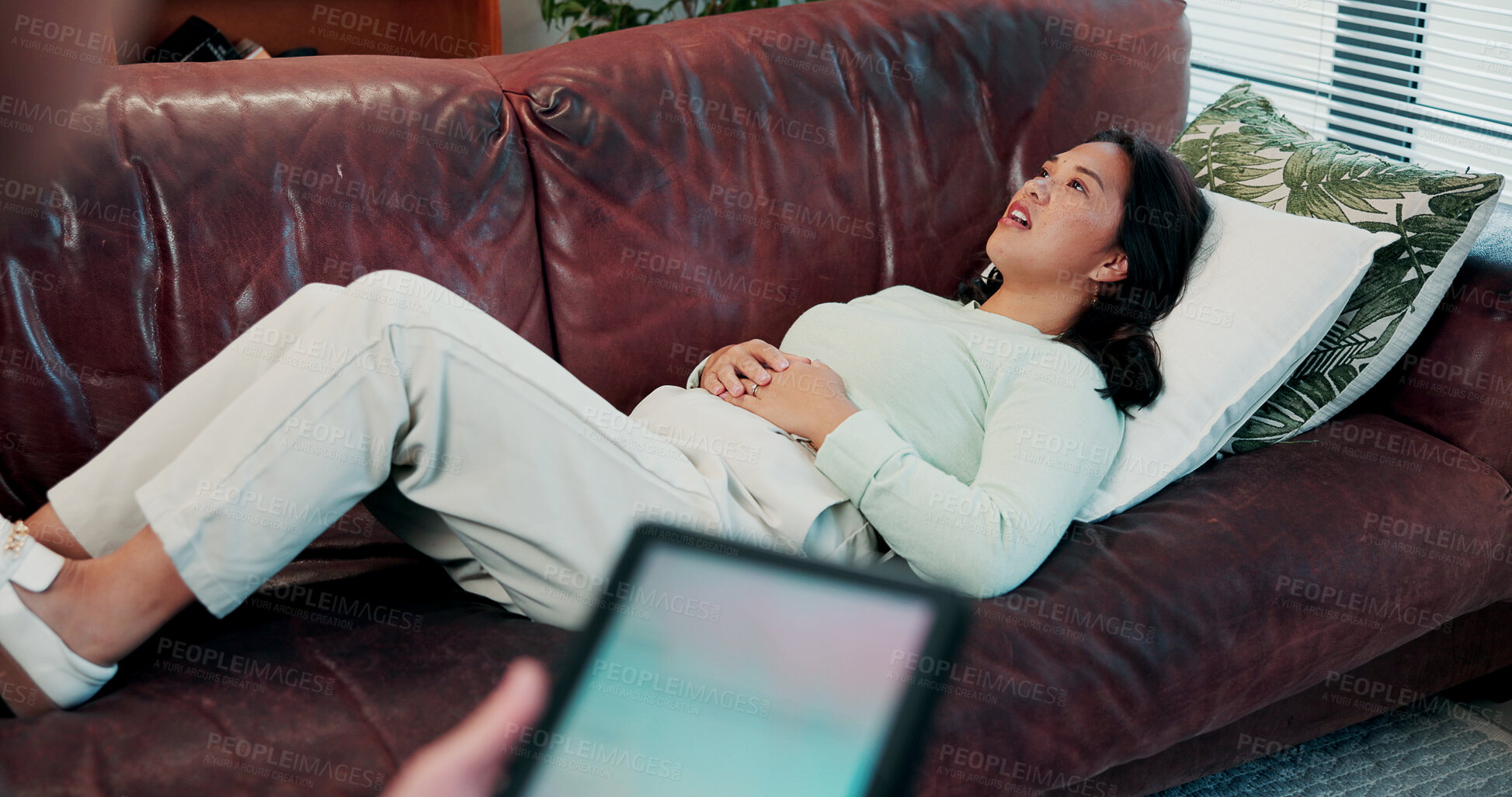 Buy stock photo Therapy, woman and conversation with grief, stress and sharing for counselling and mental health. Psychology, patient and tablet for evaluation in clinic with consultation, anxiety or trauma support