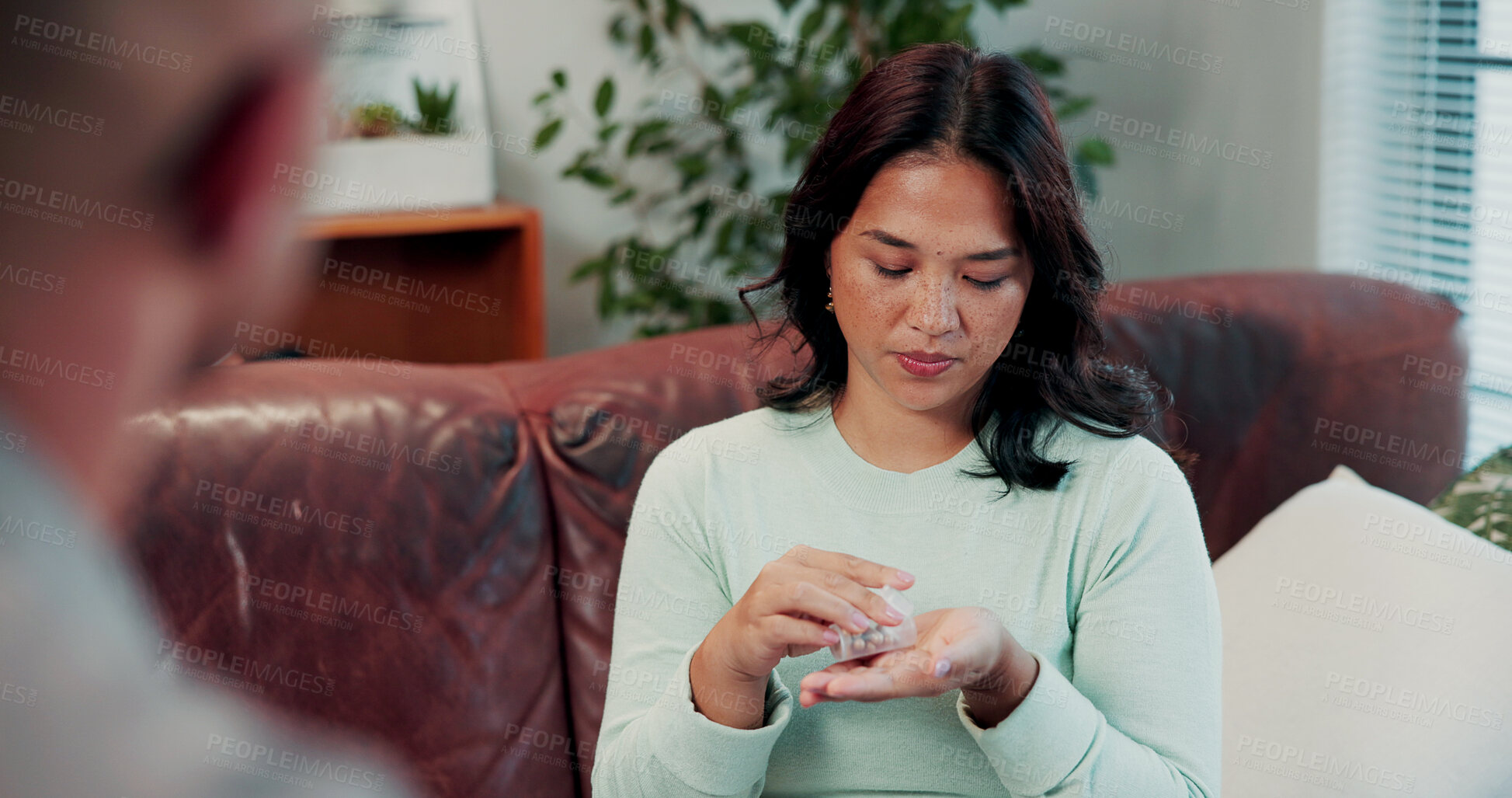 Buy stock photo Woman, pills and healthcare on sofa for consultation, communication or prescription for wellness. Pharmaceutical discussion, physician and person with depression, medication or support for treatment