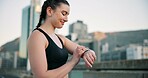 Fitness, smile and time with woman in city for progress, training or workout tracking as runner. Buildings, exercise and watch with happy athlete outdoor in urban town for health or wellness activity