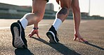 Fitness, legs or sprinter on road with start position, speed development training or acceleration drills. Feet, outdoor exercise or person with workout for pace practice, city street or ready to run