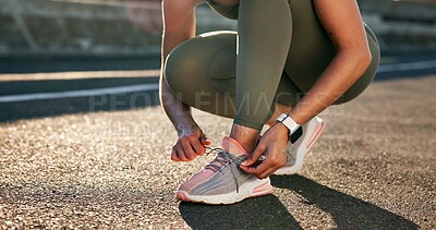 Buy stock photo Hands, fitness and woman tie laces in city for running, workout or training for wellness outdoor. Athlete, sports and female person with sneakers preparing for cardio exercise, health or active.
