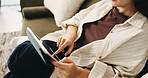 Hands, relax and tablet with woman on sofa in living room to search review of streaming service. App, scrolling and sign up selection with person browsing subscription options for choice or decision
