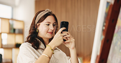 Buy stock photo Woman, phone and photo with canvas for painting with smile, hobby or creative process with stroke for project. Person, smartphone and easel with mobile app, photography and social media at apartment