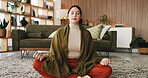 Woman, meditation and lotus on floor in home with breathing exercise, wellness and zen in lounge. Person, yoga and pose with mudra on carpet, mindfulness or holistic fitness in living room at house