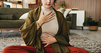 Hands, meditation and chest in house with breathing exercise, wellness and zen on lounge floor. Person, yoga and pose with mudra on carpet, mindfulness or holistic fitness in living room at home