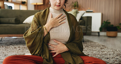Buy stock photo Hands, meditation and chest in house with breathing exercise, wellness and zen on lounge floor. Person, yoga and pose with mudra on carpet, mindfulness or holistic fitness in living room at home
