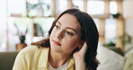 Thinking, calm and woman on sofa in home for reflection, nostalgia and daydreaming on weekend. Apartment, bored and person on couch with memory, thoughtful and wondering for planning day on break