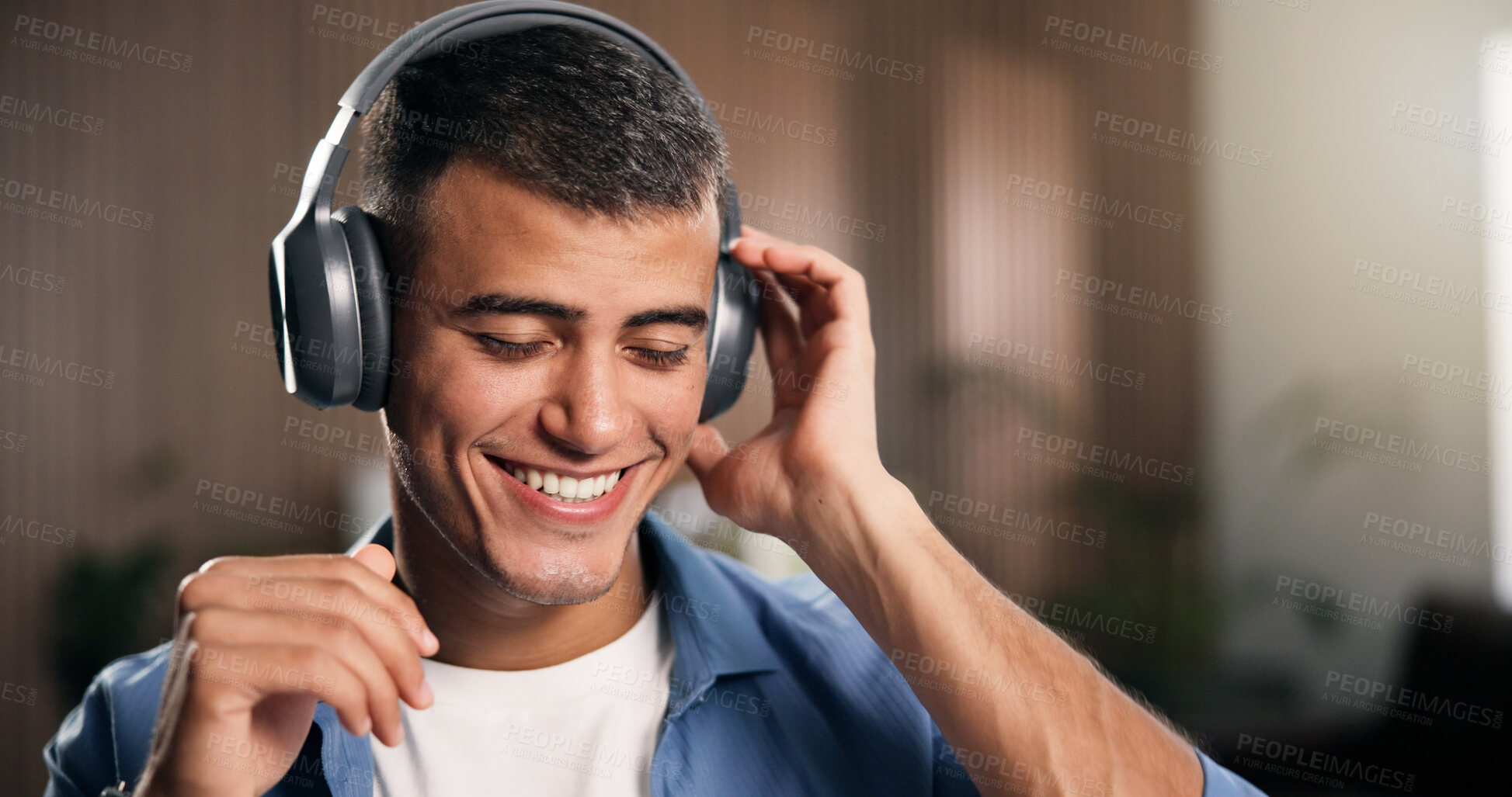 Buy stock photo Headphones, happy and man in home with remote work for creative project with listening to music. Audio tech, smile and male editor streaming playlist with dance for freelance publishing in apartment.