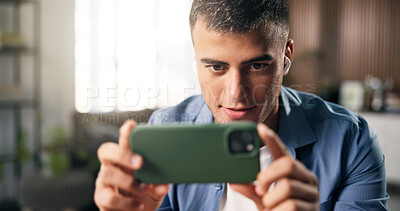 Buy stock photo Earphones, watch or man with smartphone in home, streaming web series or attention for online show. Movie subscription, mobile or person with interest for video scene, weekend binge or film franchise