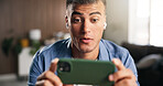 Earphones, surprise or man with smartphone in home, streaming web series or attention for online show. Movie subscription, tech or person with shock for video scene, binge watching or action film