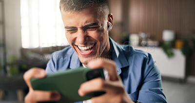 Buy stock photo Earphones, laughing or man with phone in home, streaming web series or online comedy show on weekend. Movie subscription, tech or person with smile for funny scene, binge watching or film franchise