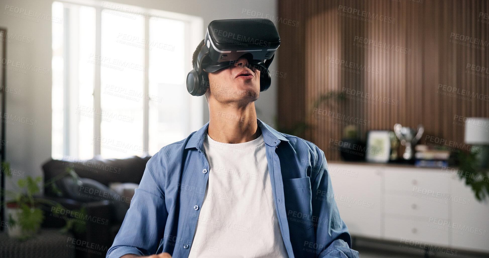Buy stock photo Virtual reality, smile and man on sofa for online gaming, metaverse or connection in home. Happy, person and living room with VR headset for augmented user experience, simulation or entertainment