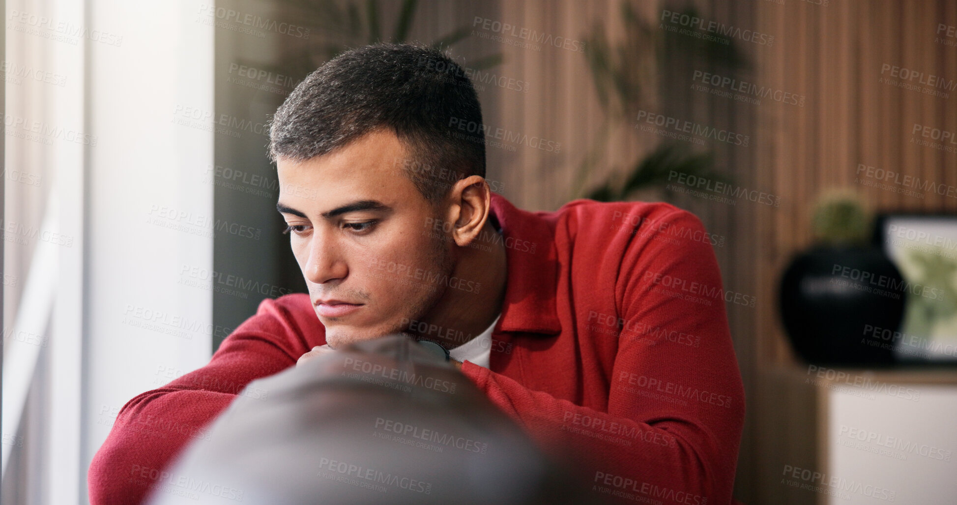 Buy stock photo Sad, loneliness and man by window in home with ideas, mental health or anxiety on weekend break. Disappointed, upset and male person with depression, reflection or thinking in living room at house.