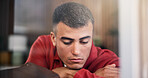 Disappointed, upset and man by window in home with ideas, mental health or anxiety on weekend break. Sad, loneliness and male person with depression, reflection or thinking in living room at house.