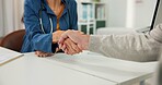 Handshake, medical and welcome with people in office for consulting, medical advice and meeting. Greeting, healthcare and introduction with doctor and patient shaking hands in clinic for checkup