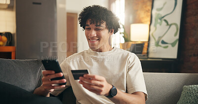 Buy stock photo Happy man, phone and credit card on sofa in home with sale, code or choice with financial freedom. Person, smartphone and smile with digital banking, mobile app and fintech for ecommerce at house