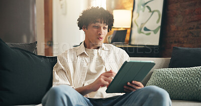 Buy stock photo Smile, relax and man with tablet on sofa for social media post, reading and online update. Networking, newsletter subscription and connection with person in living room of home for chat and scroll