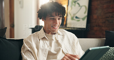 Buy stock photo Tablet, smile and man in home, typing for communication and message to contact. Online humor, tech and person on sofa, subscription and digital app for social media, entertainment and website info