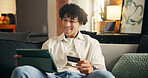 Happy man, tablet and credit card on sofa in home with sale, payment or choice with financial freedom. Person, tech and smile with digital banking, application or fintech for ecommerce order at house
