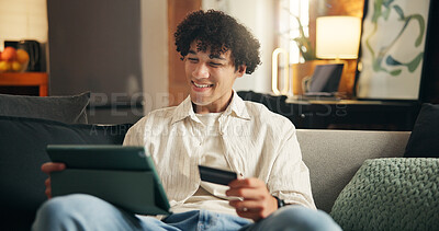 Buy stock photo Happy man, tablet and credit card on sofa in home with sale, payment or choice with financial freedom. Person, tech and smile with digital banking, application or fintech for ecommerce order at house