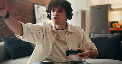 Buy stock photo Angry, serious and video game with man on sofa in home living room for online competition. Controller, defeat and frustration with annoyed gamer in apartment for challenge, contest or tournament