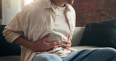 Buy stock photo Man, hands and sick in home with stomach ache, indigestion and inflammation from diarrhea problem. Person, abdomen pain and medical issue on couch with constipation, bowel discomfort and bloating.