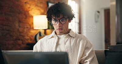 Buy stock photo Man, research and laptop in apartment with remote work, glasses and journalist proofreading for story. Freelance writer, person and review article in home with computer, website and online blog post.