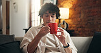 Coffee, cup and relax with man in home living room for caffeine, start of morning or weekend. Beverage, break and cozy with person on sofa in apartment for me time, stress relief or wellness
