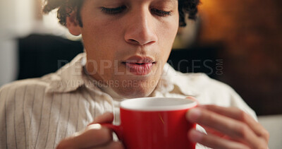 Buy stock photo Blow, coffee and hot with man in home living room for caffeine, start of morning or weekend. Beverage, relax and rest with person cooling drink in apartment for break, stress relief or wellness