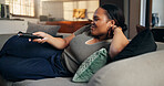 Black woman, choice and watching tv with remote in home for entertainment, streaming or video. Female person, happy and channel with smile for movie subscription, online connection or series in house