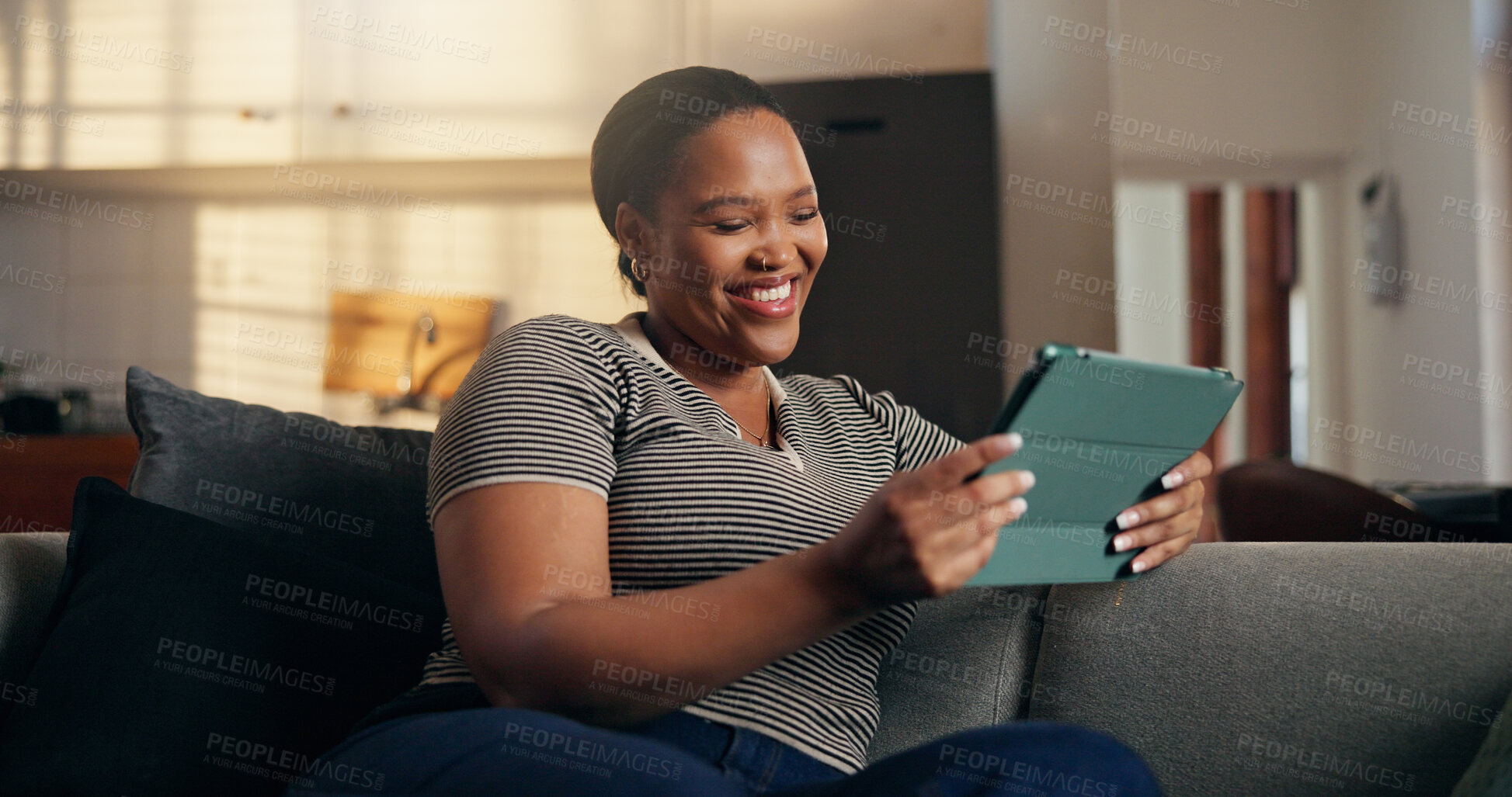 Buy stock photo Relax, woman and laugh with tablet on sofa for comedy movie, funny online show and weekend break. Happy, black person or digital app in home for watching comic series, internet entertainment or humor