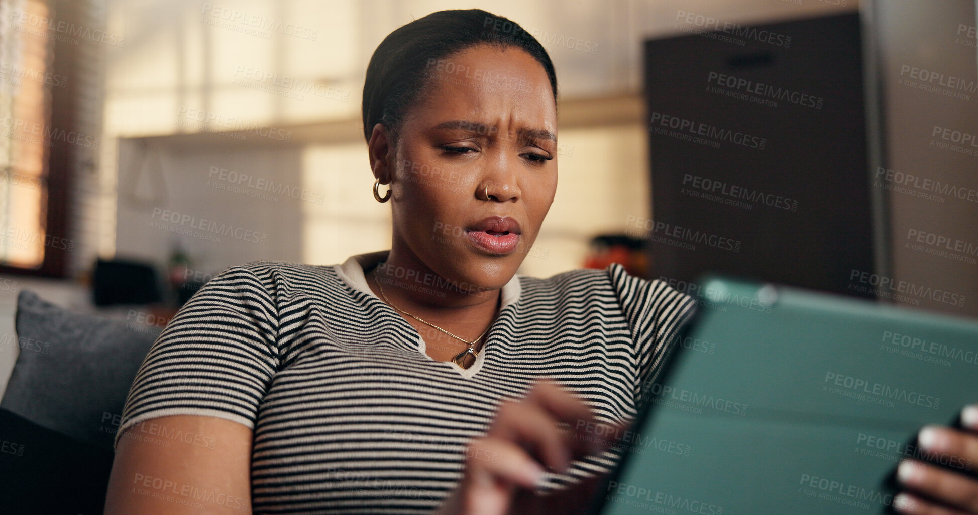 Buy stock photo Confused, gossip and black woman with tablet on sofa for shock, online message and chat in home. Surprise, social media and person with tech for rumor, fake news and negative notification on app