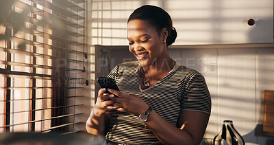 Buy stock photo Smile, woman and typing with phone in home for texting, chat notification or message response. Happy, black person or smartphone in kitchen for social media post, online conversation or weekend break