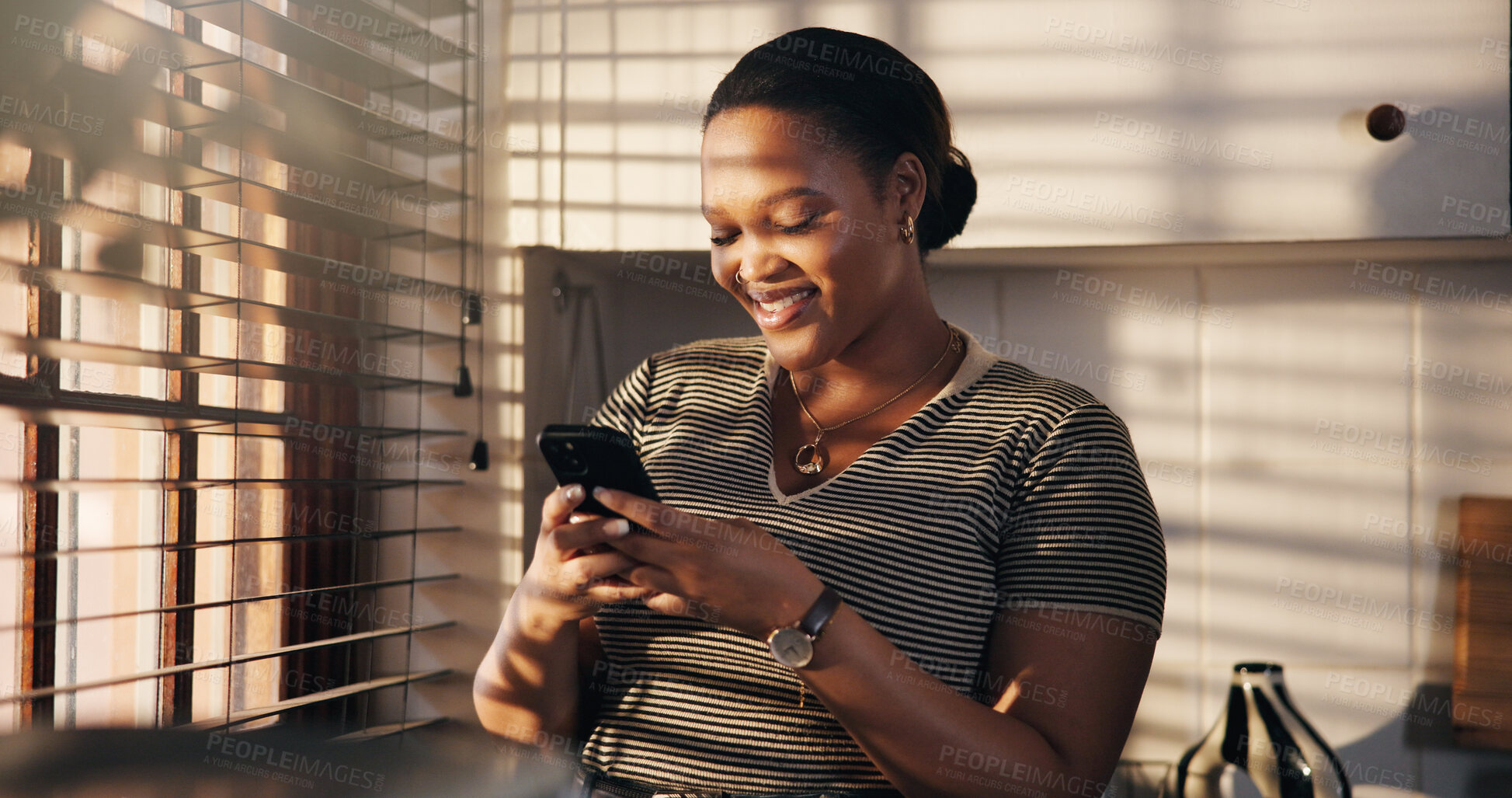 Buy stock photo Smile, woman and typing with phone in home for texting, chat notification or message response. Happy, black person or smartphone in kitchen for social media post, online conversation or weekend break