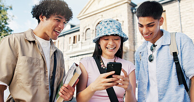 Buy stock photo Friends, college student and laugh with phone at campus, share meme or funny video on web. People, group and happy with smartphone, education and bonding with post on social media at university