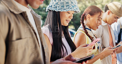 Buy stock photo Woman, students and phone in college with social media, text message and scholar website for education. People, scroll and reading outdoor at university with tech, mobile app and email notification.