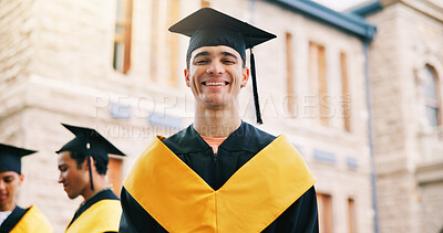 Buy stock photo Man, college student and smile for graduation at campus with pride, cap and gown with ceremony for goals. Person, happy and outdoor in portrait, milestone or success with achievement at university