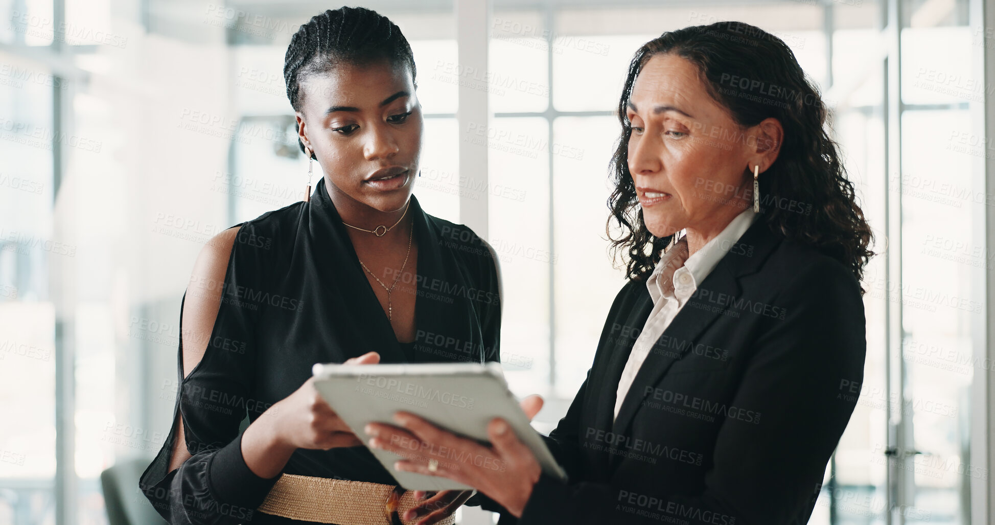 Buy stock photo Review, discussion and business people with tablet in office, trend research or investment proposal. Reading, manager or advisor with economic report for opportunity, tech or explain market indicator