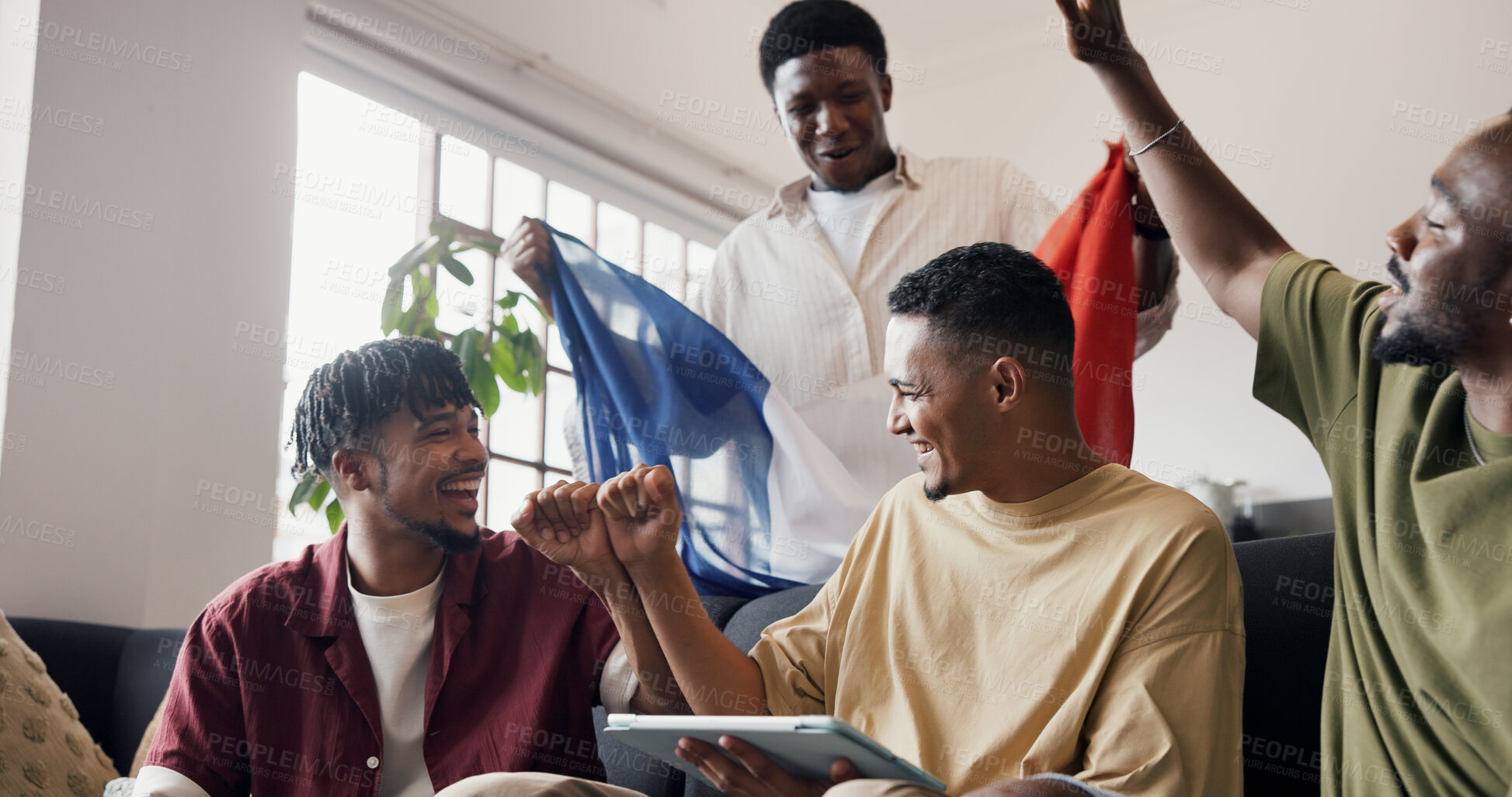 Buy stock photo Soccer game, fist pump and men in lounge, tablet and celebration for score update. France flag, winning and people in home, world champion or cheering for sports match, support or contest victory