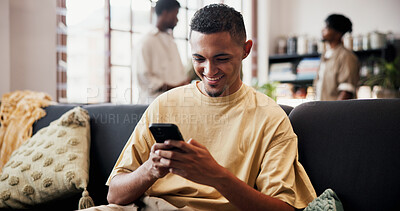 Buy stock photo Smile, reading and man with phone on couch, check social media notification and watch online video. Digital communication, typing and person with mobile in home for message, blog or browsing internet
