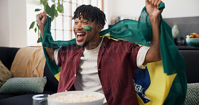Buy stock photo Man, flag and celebration in home, soccer and cheering for champion, shouting or winning. Fan, screaming or person in lounge, football or excited for score lead, tournament or supporter in Brazil