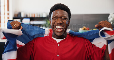 Buy stock photo Black man, portrait and celebration in home, football and cheering for champion, shouting and supporter. Fan, screaming and person in lounge, soccer and excited for score lead, UK flag or winning