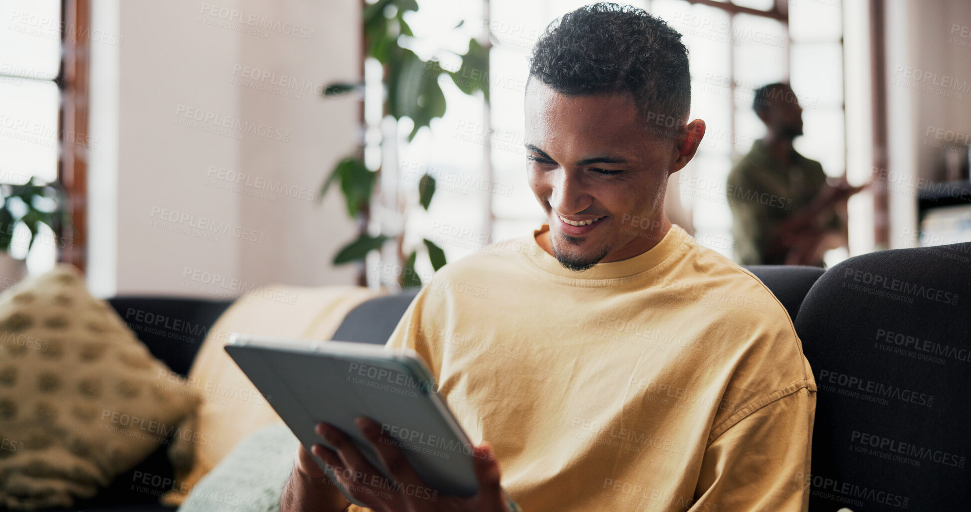 Buy stock photo Smile, reading and man with tablet on sofa, online streaming platform and movie subscription website. Internet, connection and happy person with tech for film, watch show and ebook in friends home