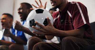 Buy stock photo Hands, friends and celebration with football in home on couch, cheers and fist pump for goal in lounge. People, excited and group with watching tv, soccer game or global competition at apartment
